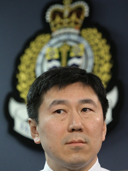 Vancouver Police Chief Jim Chu listens to a reporter's question after announcing several gang-related arrests during a news conference in Vancouver, B.C., on Friday, March 6, 2009. (CP/Darryl Dyck)