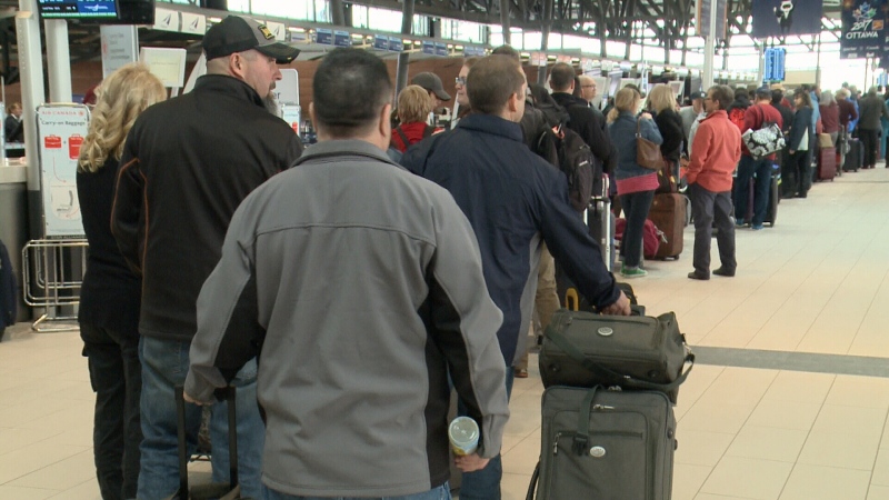Passengers line up at the Ottawa airport to board a flight for Cuba. Many Canadian travellers say they've changed their travel plans to the U.S. because of Donald Trump. (Tyler Fleming/CTV Ottawa, February 7, 2017)