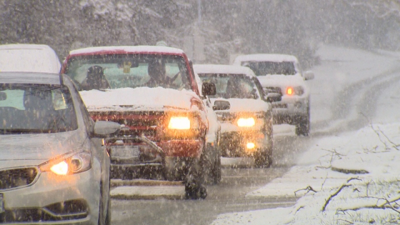 Motorists drive through snow in this file photo. 