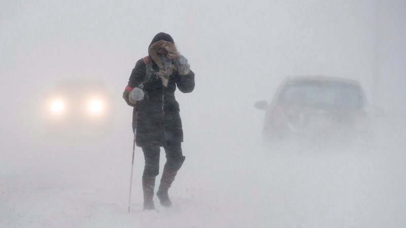 A pedestrian walks down Brunswick Street near Citadel Hill in Halifax as a major winter storm blasts the Maritimes on Monday, Feb. 13, 2017. (Andrew Vaughan/The Canadian Press) 