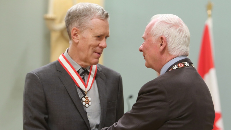Author and humorist Stuart McLean, of Toronto, is presented with the Officer of the Order of Canada medal by Governor General David Johnston during a ceremony at Rideau Hall, the official residence of the Governor General, in Ottawa on Friday, September 28, 2012. (Source: Fred Chartrand/The Canadian Press)