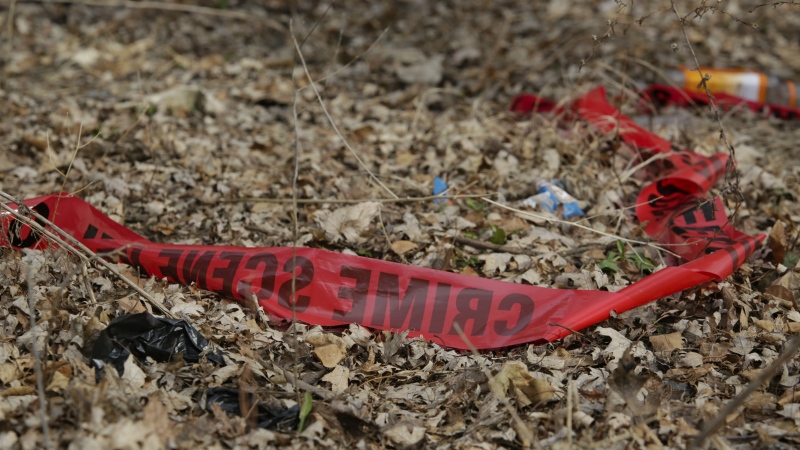 Police tape litters the ground at the scene of a Feb. 14, shooting that killed a toddler and a man who authorities say was the intended target in Chicago, Ill. on Feb. 15, 2017. (AP / Teresa Crawford)