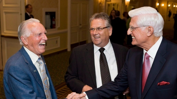 Ed Lumley (right), Chancellor of the University of Windsor, shakes hands with Bob White (left), the first President of the CAW, with Ken Lewenza at a fundraiser roast for the new Centre for Engineering Innovation at the Royal York in Toronto on Wednesday May 30, 2012. (THE CANADIAN PRESS/Aaron Vincent Elkaim)
