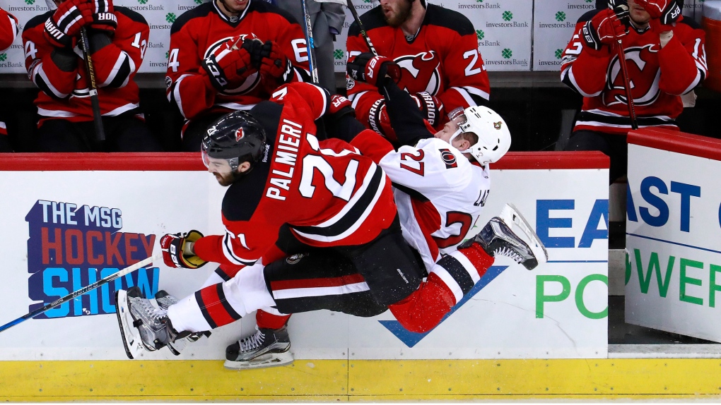 New Jersey Devils right wing Kyle Palmieri (21) and left wing