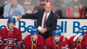 Montreal Canadiens head coach Claude Julien looks on from the bench during an NHL hockey game against the New York Islanders, in Montreal on Thursday, February 23, 2017. THE CANADIAN PRESS/Graham Hughes