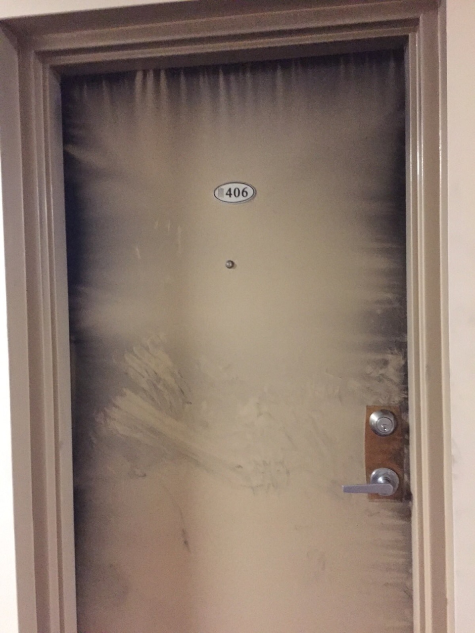 Door of unit where there was a fatal fire 