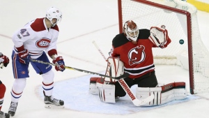 Montreal Canadiens right wing Alexander Radulov, (47) of Russia, watches the puck go in the net for the winning goal past New Jersey Devils goalie Cory Schneider (35) during overtime in an NHL hockey game Monday, Feb. 27, 2017, in Newark, N.J. The Canadiens won 4-3 in overtime. (AP Photo/Mel Evans)