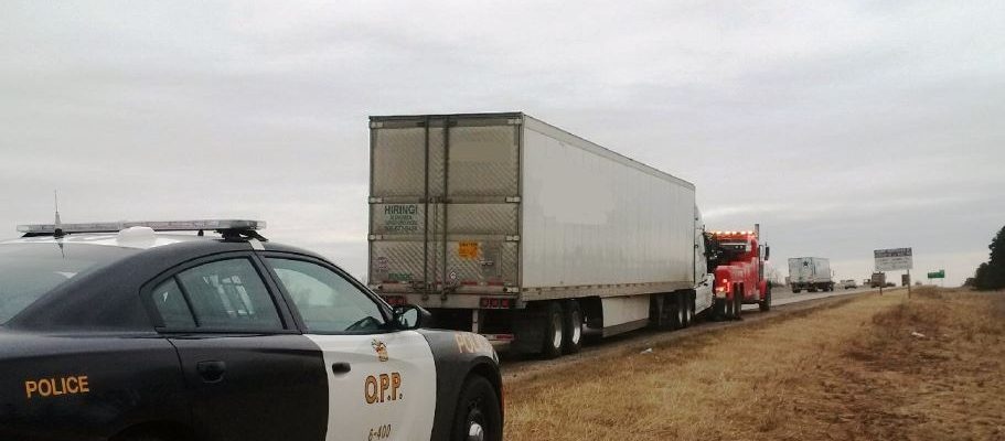 OPP officers stop a tractor trailer on the 401 