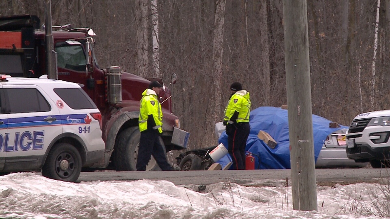 Police attend the scene of a fatal collision between a car and a dump truck in Navan, Ont. on Monday, Mar. 6, 2017.