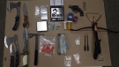 Drugs and weapons seized from a home by Stratford Police are shown in this photograph. (Stratford Police)