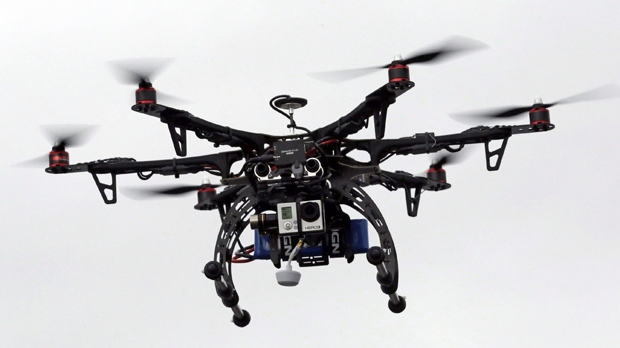 In this Feb. 13, 2014, file photo, a drone is demonstrated in Brigham City, Utah. (AP Photo/Rick Bowmer, File)