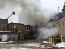 Firefighters in Clinton continue to battle a fire at the main intersection of the town on Saturday, March 18, 2017. They are trying to keep the fire from spreading to the town hall next door.
(Nadia Matos / CTV Kitchener) 