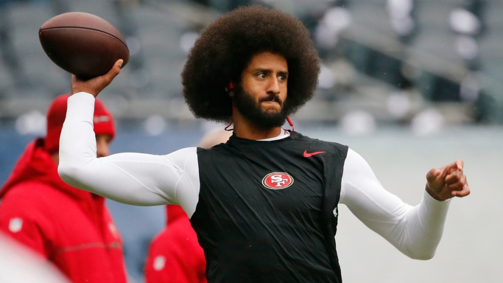 Colin Kaepernick warms up in 2016