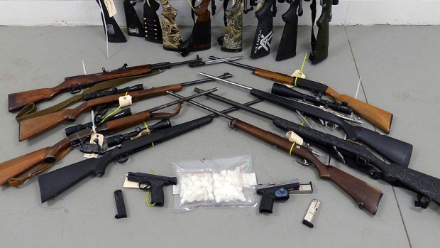 Arsenal of firearms seized in Whitecourt, four facing charges - CTV News
