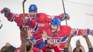 Alex Galchenyuk celebrates with Andrew Shaw and Artturi Lehkonen after scoring the first goal against the Carolina Hurricanes in Montreal on Thursday, March 23, 2017. THE CANADIAN PRESS/Ryan Remiorz