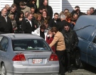 Family and friends grieve at the funeral of helicopter crash victim Allison Maher at St. Charles Borromeo Church in Fermeuse, N.L., Monday, March 16, 2009. (Rhonda Hayward / THE CANADIAN PRESS)