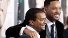 In this Dec. 16, 2008, file photo, Will Smith, right, and Alfonso Ribeiro pose together at the premiere of 'Seven Pounds' in Los Angeles. (AP Photo/Matt Sayles, File)