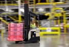 In this Feb. 13, 2015, file photo, a forklift operator moves a pallet of goods at an Amazon.com fulfillment center in DuPont, Wash. (AP / Ted S. Warren)