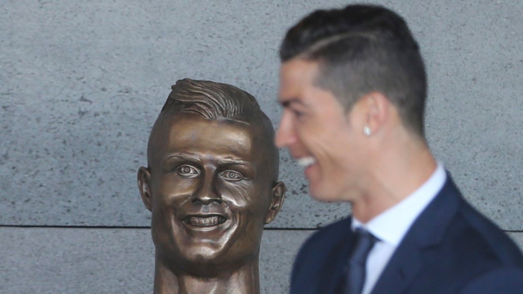 Cristiano Ronaldo with a bust in his likeness