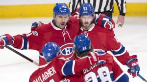 Montreal Canadiens left wing Paul Byron (41) celebrates with teammates Tomas Plekanec (14), Brendan Gallagher (11) and Nathan Beaulieu (28) on Thursday, March 30, 2017. THE CANADIAN PRESS/Ryan Remiorz