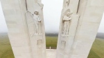 Angels  are shown near the top of the Canadian National Vimy Memorial, with Mother Canada framed between the pillars in the distance, in this image from Vimy, France. (Google Canada)