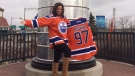 Shauna Gonek poses with two new Oilers jerseys she traded for an old engagement ring, outside of United Cycle on Calgary Trail Friday, April 7, 2017. Gonek also received beer and $500 in the trade. Supplied.