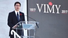 Canadian Prime Minister Justin Trudeau addresses the audience during a ceremony marking the 100th anniversary of the Battle of Vimy Ridge at the WWI Canadian National Vimy Memorial in Vimy, France, Sunday, April 9, 2017.  (Philippe Huguen/Pool Photo via AP)