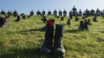 Canadian Forces soldiers parade at Vimy Ridge behind boots placed to honour the approximately 3,600 soldiers killed in the Battle of Vimy Ridge, near Arras, France Sunday, April 9, 2017. (Adrian Wyld / THE CANADIAN PRESS)