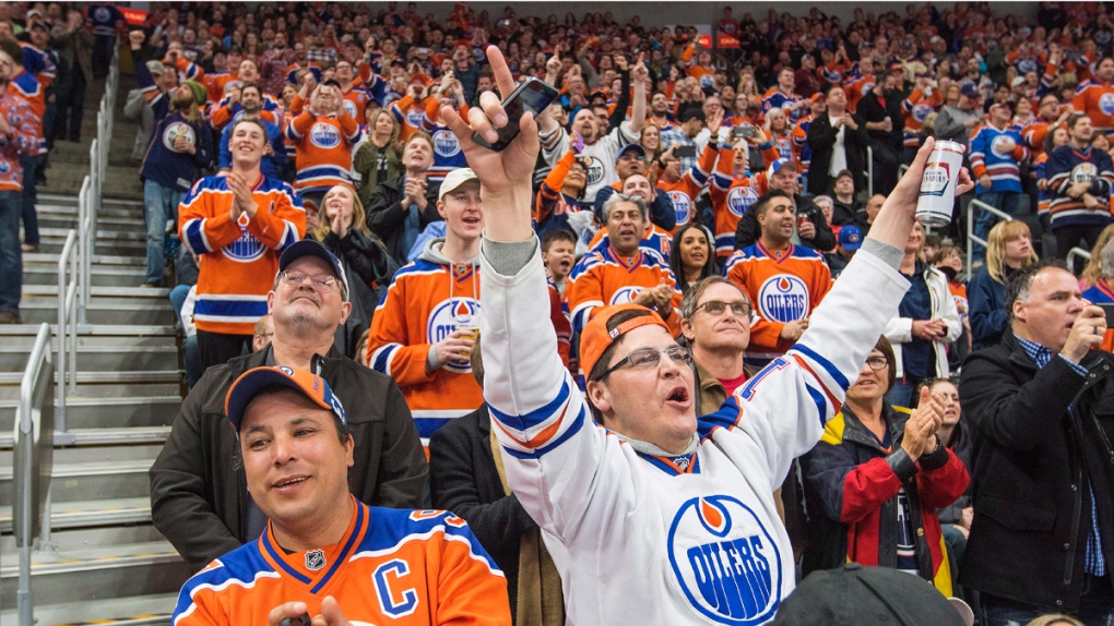Fans celebrate an Edmonton Oilers goal