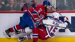 Jordie Benn demonstrates the grit that made him a Canadien as he flattens Tanner Glass during the first period of the first playoff game on April 12, 2017. (The Canadian Press/Ryan Remiorz)