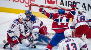 Montreal Canadiens' Tomas Plekanec celebrates his goal past New York Rangers goaltender Henrik Lundqvist as Rangers' defenseman Nick Holden (22) looks on during third-period Game 2 NHL Stanley Cup first-round playoff hockey game action Friday, April 14, 2017, in Montreal. (Paul Chiasson/The Canadian Press via AP)