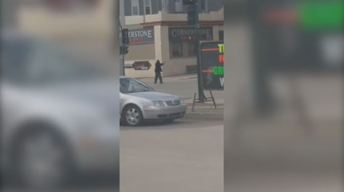 A man points a BB gun on Main Street in Moose Jaw on April 16, 2017 (Facebook: Shelby Guillaume)