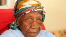 The world's oldest person Violet Brown poses for a photo at her home in Duanvale, Jamaica, Sunday, April 16, 2017. The 117-year-old woman living in the hills of western Jamaica is believed to have become the world's oldest person, according to groups that monitor human longevity. (AP Photo/Raymond Simpson)