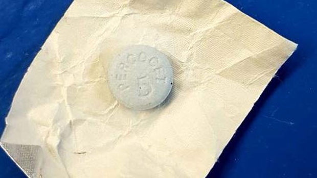 Police say the seized pill is blue, about one centimetre in diameter and inscribed with "Percocet 5." (New Brunswick RCMP)