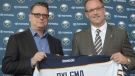 In this May 28, 2015 file photo, Buffalo Sabres GM Tim Murray, left, and coach Dan Bylsma hold a Sabres' jersey as they pose for a photo after a news conference in Buffalo, N.Y. (AP / Gary Wiepert)