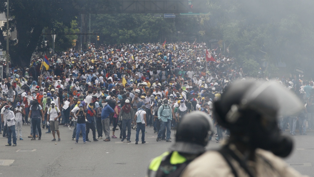 Protesters march in Caracas