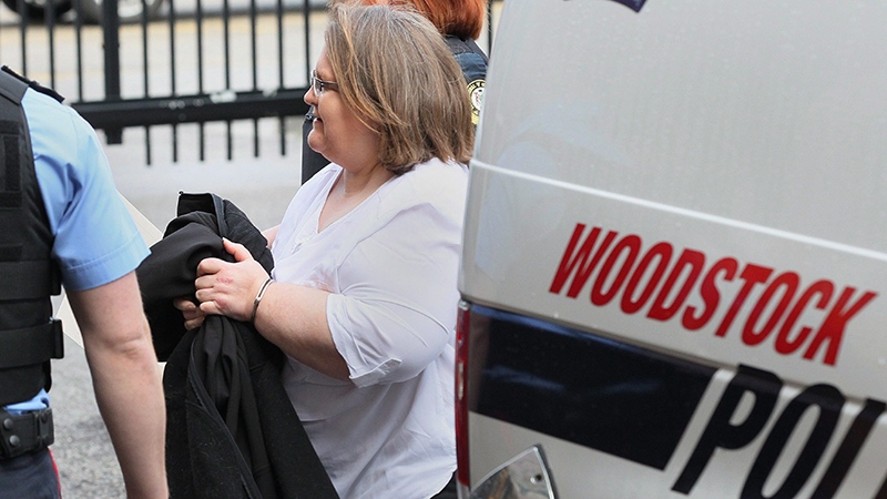 Elizabeth Wettlaufer is escorted into the courthouse in Woodstock, Ont., on Friday, April 21, 2017. (Dave Chidley/The Canadian Press)