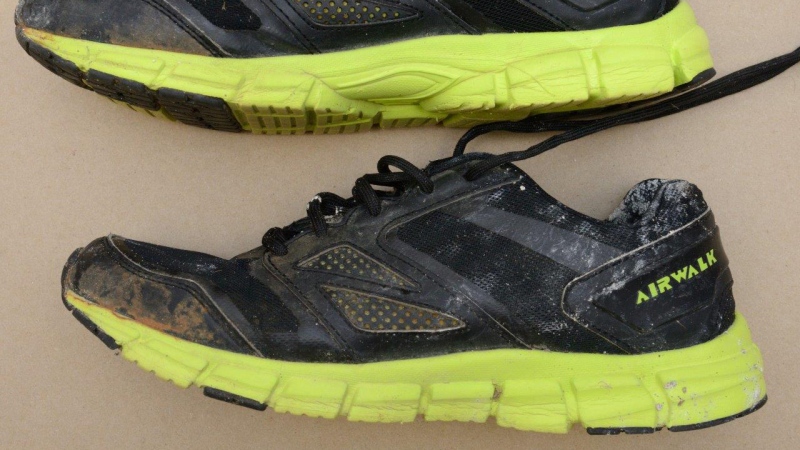  Size 11, black "Airwalk" running shoes, with a distinctive fluorescent yellow/green sole and tongue - worn by the man found dead along the shore of the Ottawa River in Wendover, Ont. (OPP) 