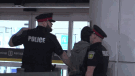 Two police officers are shown arresting a suspect at Pearson International Airport early Saturday morning.