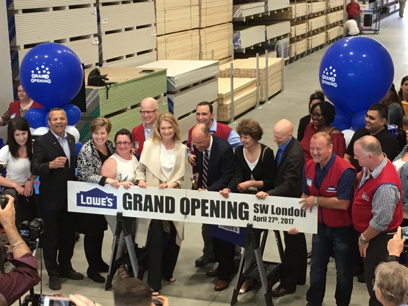 London Mayor Matt Brown is in the center, cutting the board in London, Ont. (Courtesy Lowe's Canada)