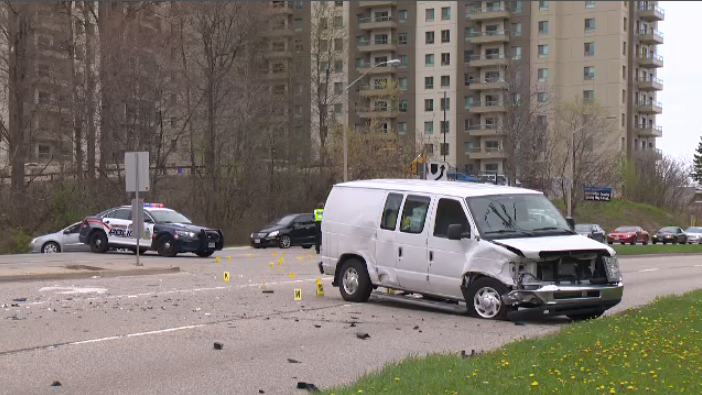 A damaged vehicle sits on a roadway in Kitchener