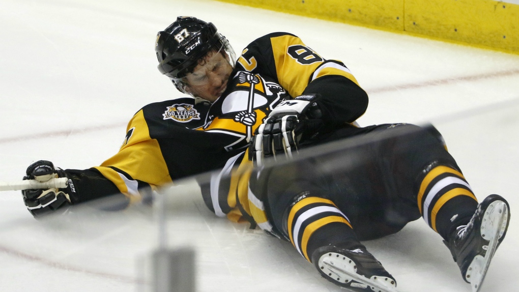 Crosby leaves game after hit to the head