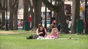 Two people enjoy a sunny day in Saskatoon in this file photo.