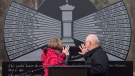 Allen and Debbie Martin touch the monument engraved with the names of the 26 coal miners who perished in the Westray mine disaster, at the Westray Miners Memorial Park in New Glasgow, N.S. on Tuesday, May 9, 2017. Allen's brother, Glenn Martin, was killed when the coal mine exploded 25 years ago to the day on May 9, 1992. (THE CANADIAN PRESS/Andrew Vaughan)