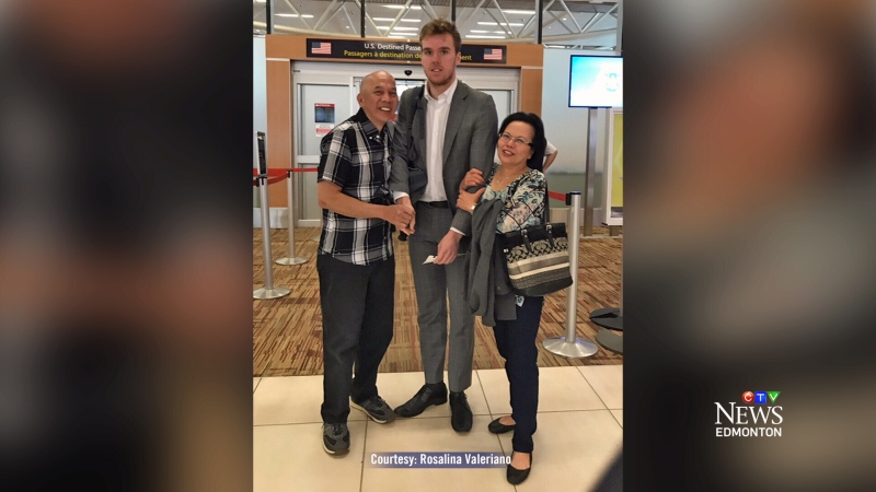 Jimmy and Rosalina Valeriano pose with Connor McDavid at the Edmonton International Airport on Tuesday, May 9, 2017. Supplied.