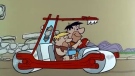Fred Flintstone and Barney Rubble are shown in a scene from the cartoon 'The Flintstones.' (IMDB)