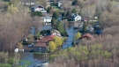 Flooded homes are seen from the air Thursday May 11, 2017 in Gatineau, Que. (Adrian Wyld/The Canadian Press)