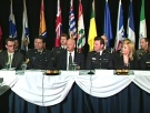 Police investigators and representatives from agencies from across the country speak during a press conference in Ottawa, March 26, 2009.