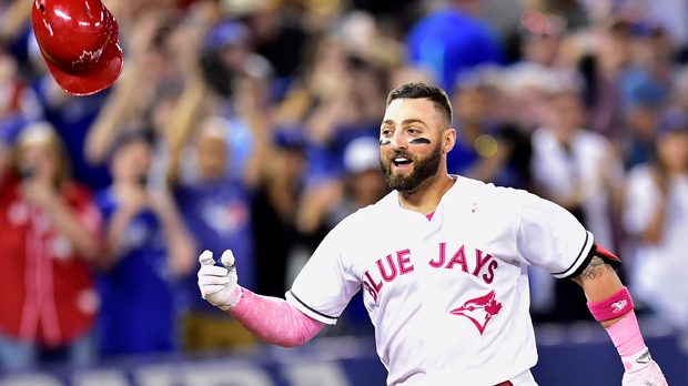 Toronto Blue Jays outfielder Kevin Pillar (11) celebrates his game winning home run against the Seattle Mariners during ninth inning American League baseball action in Toronto, Sunday, May 14, 2017. THE CANADIAN PRESS/Frank Gunn