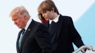 Barron Trump, with his father U.S. President Donald Trump and mother, first lady Melania Trump, disembark from Air Force One upon arrival at Palm Beach International Airport in West Palm Beach, Fla., March 17, 2017. (AP / Manuel Balce Ceneta)